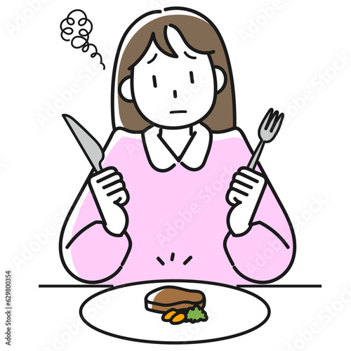 ダイエットのために食事量を減らして不満顔の若い女性