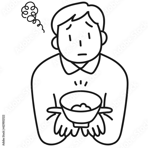 ダイエットのためにご飯を減らして不満顔の若い男性