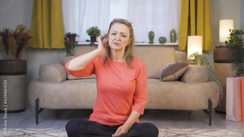 Woman with itchy ears. Woman with itchy ears.