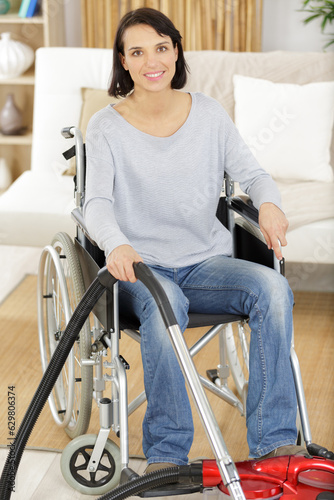 disabled woman using vacuum cleaner