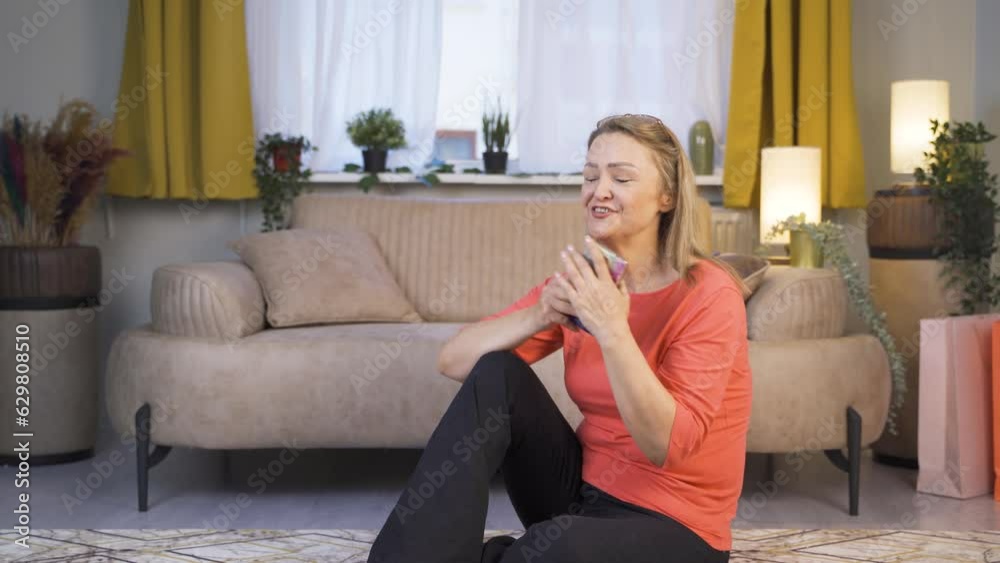 The woman who happily puts the phone to her heart.