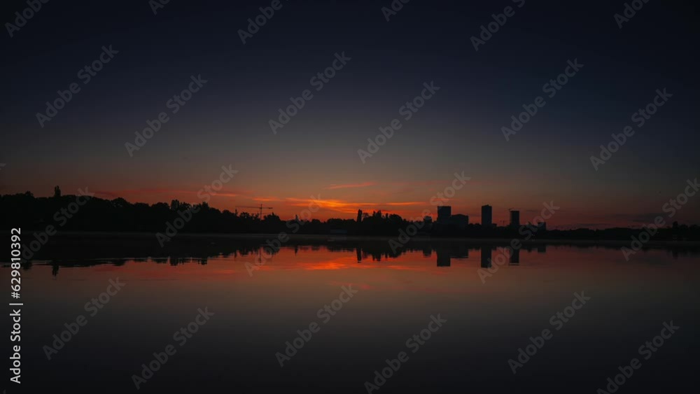 Wide angle sunrise time lapse video in Bucharest. 4K wide angle video in the dusk, Herastrau lake and park landscape in Bucharest. Travel to Romania. Wide angle sunrise time lapse video in Bucharest. 4K wide angle video in the dusk, Herastrau lake and park landscape in Bucharest. Travel to Romania.