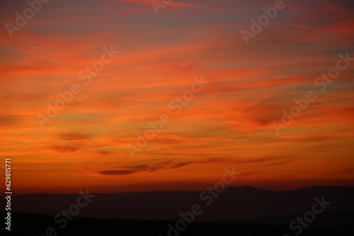 Red sunset and mountains silhouette © Halilbrahim