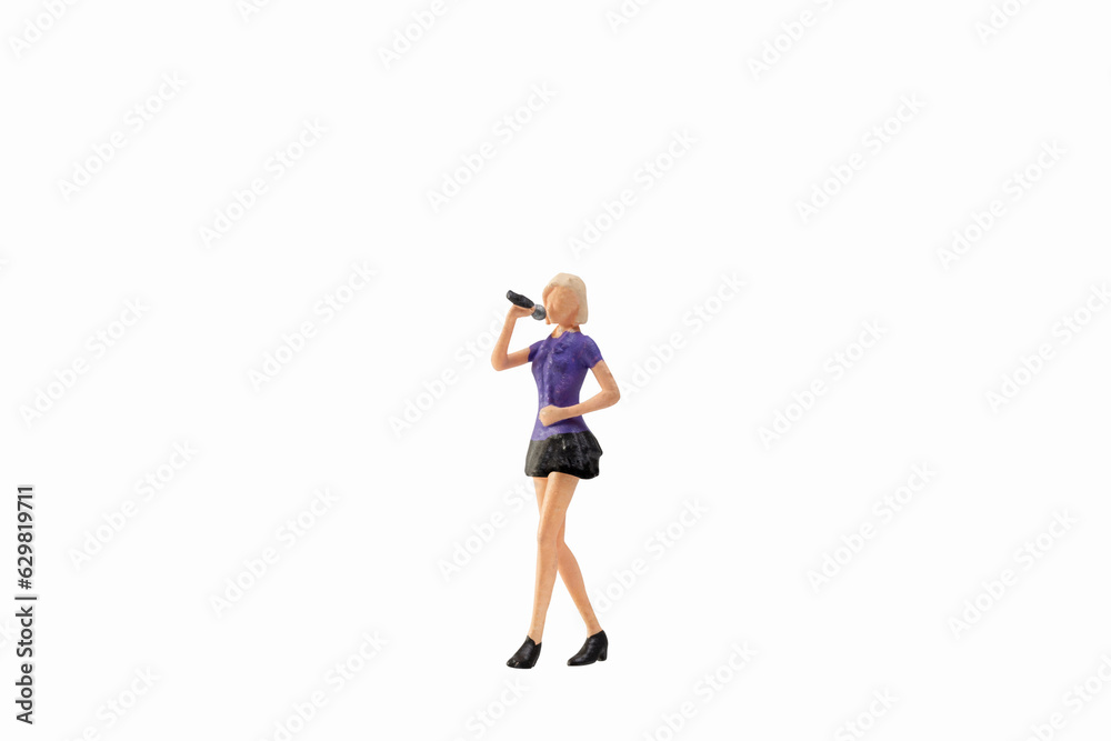 Miniature female singer isolated on white background with clipping path