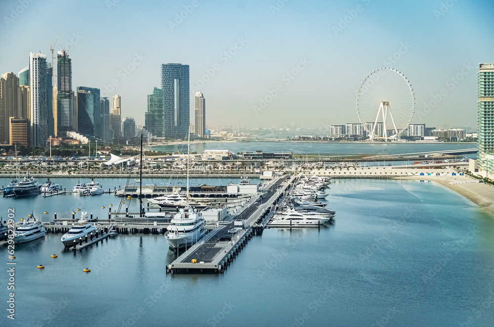 Φωτογραφία City of skyscrapers, Dubai marina in the sunny day with front line of beach hotels and blue water of Persian gulf