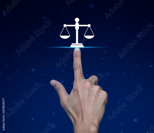 Hand pressing law flat icon over fantasy night sky and moon, Business legal service concept