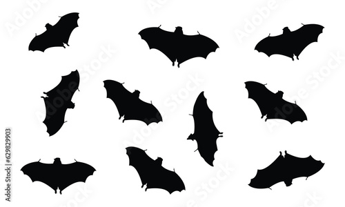 Black silhouettes of bats set on white background.