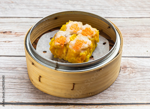 crab roe siu mei served in dish isolated on wooden table top view hong kong food photo