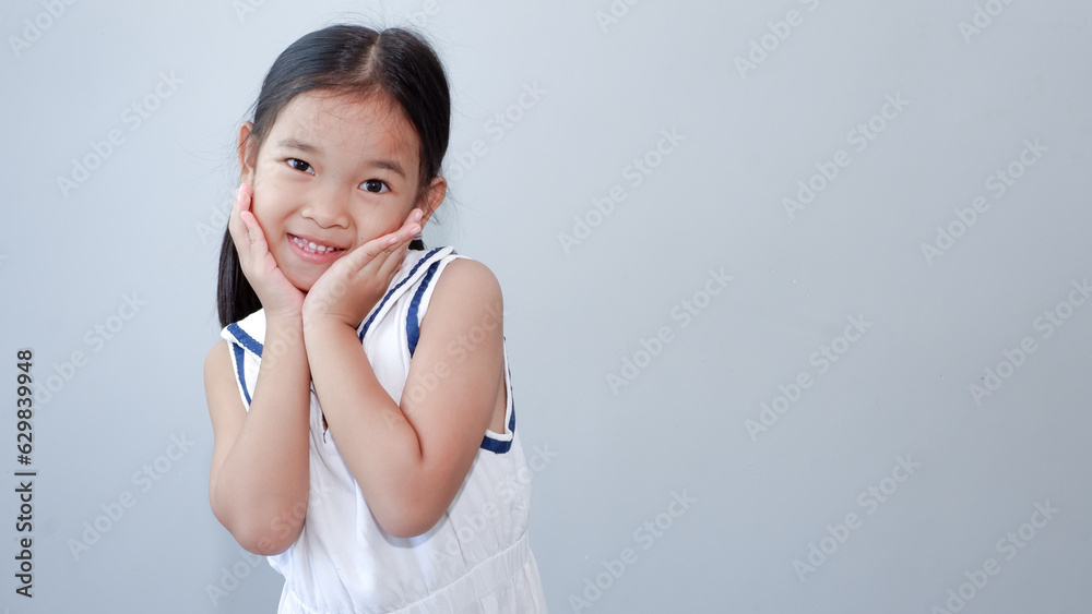 portrait of asian beautiful little girl holding chin portrait of asian beautiful little girl holding chin