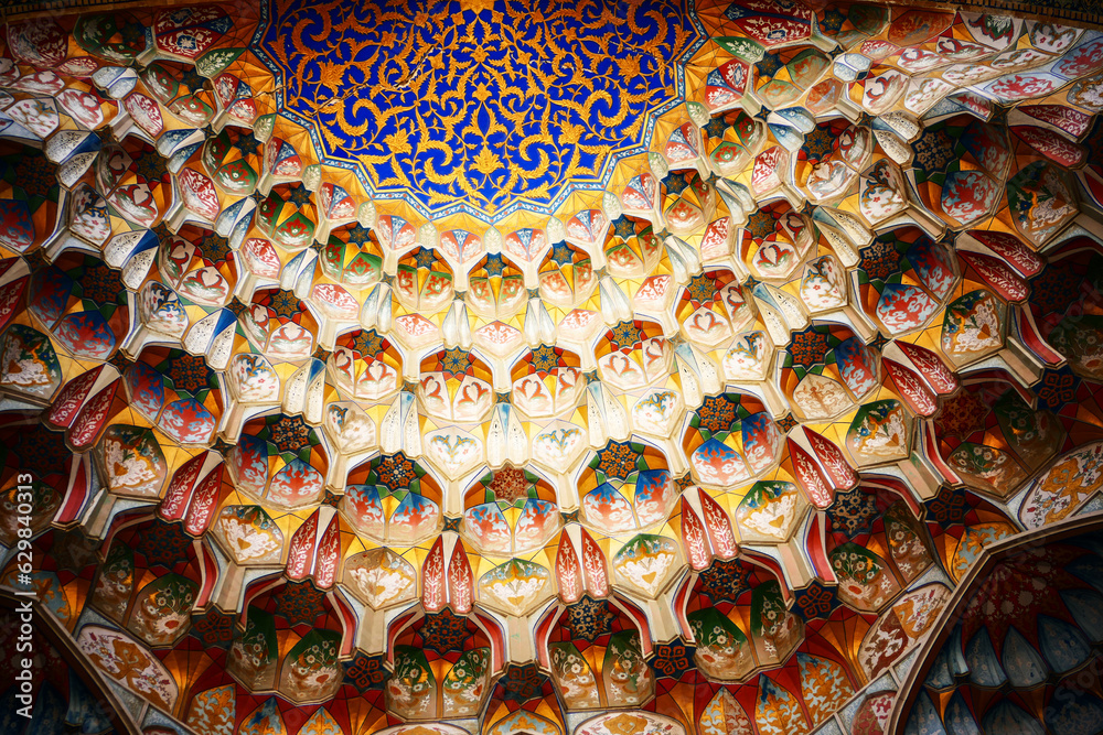 Multicolor tiled mihrab in the medieval mosque close-up	
