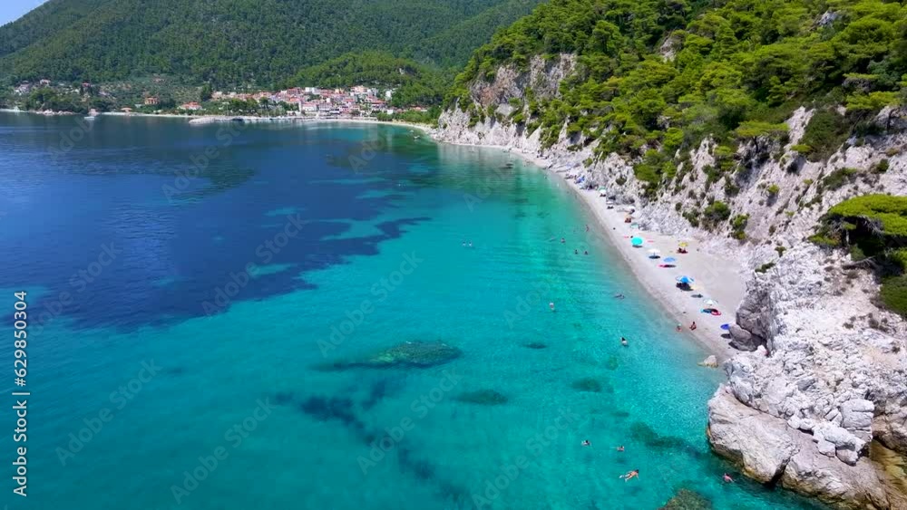 Aerial view of the beautiful Hovolo beach, Sporades, Greece, with turquoise sea and lush pine tree forest Aerial view of the beautiful Hovolo beach, Sporades, Greece, with turquoise sea and lush pine tree forest