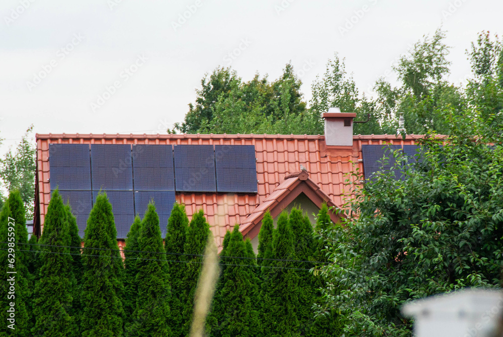 Historic farm house with modern solar panels on roof and wall Historic farm house with modern solar panels on roof and wall