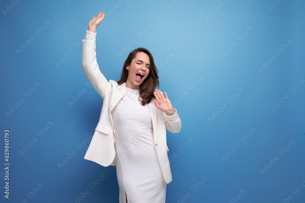 positive young lady with dark hair below her shoulders in a white dress positive young lady with dark hair below her shoulders in a white dress
