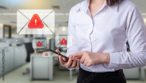 Email Spam concept. Business Woman hold smartphone