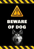 Composition of beware of dog text over warning sign and dog