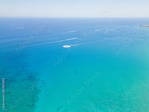 boats on crystal clear water Cyprus
