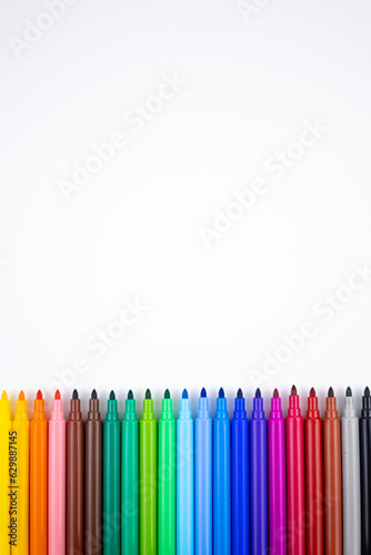 Multi-colored felt tip pens on white background. Back to school colorful banner. Copy space.