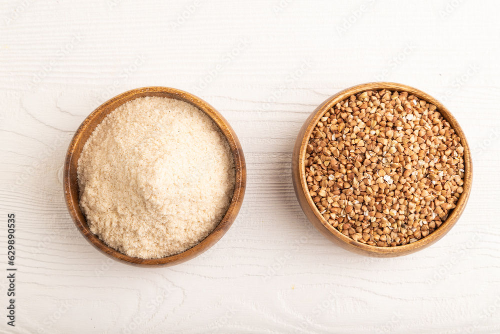 Powdered milk and buckwheat baby food mix, on white wooden, top view Powdered milk and buckwheat baby food mix, on white wooden, top view