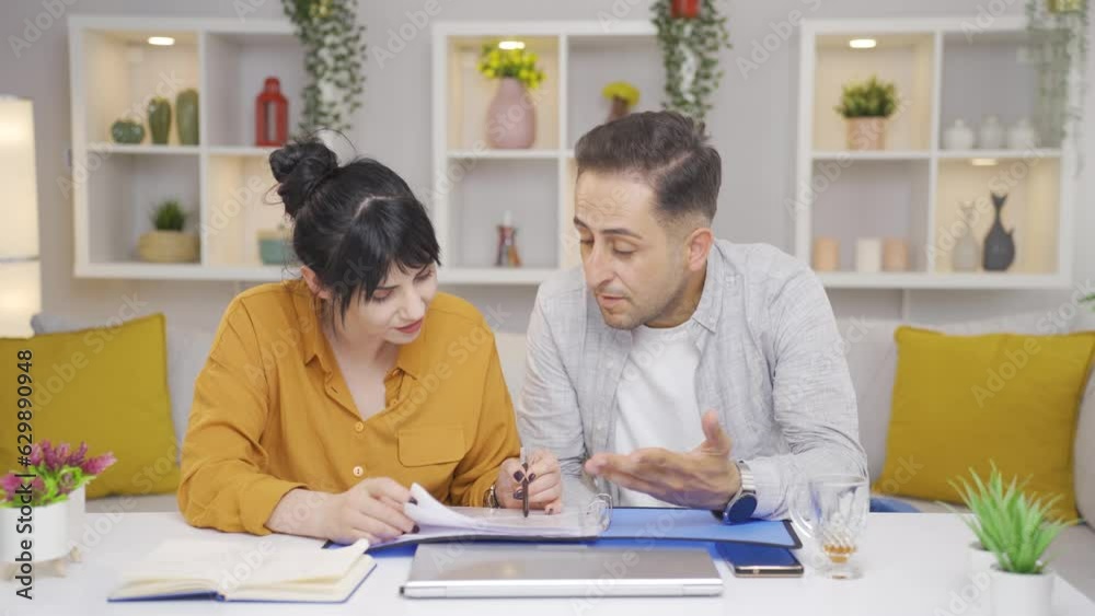 The couple looking at the file and getting angry gets angry at the file. The couple looking at the file and getting angry gets angry at the file.