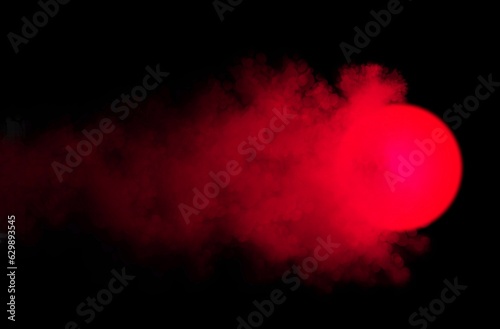 abstract background, glowing burning red ball with clouds and smoke on black background