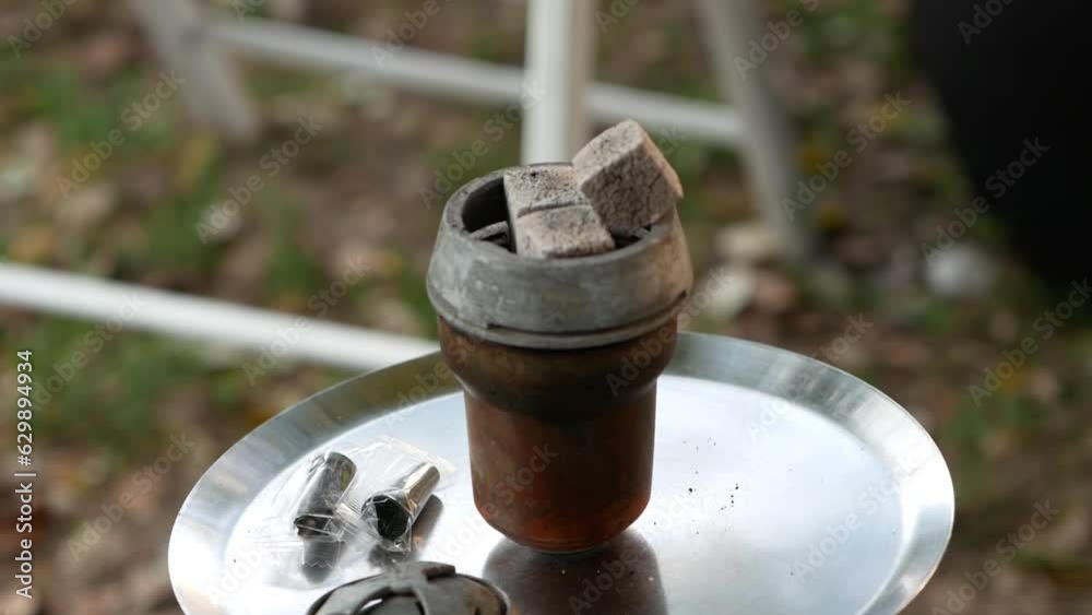 a hookah with hot coals is ready for use
rest with friends
the concept of bad habits, namely smoking a hookah with hot coals is ready for use
rest with friends
the concept of bad habits, namely smoking