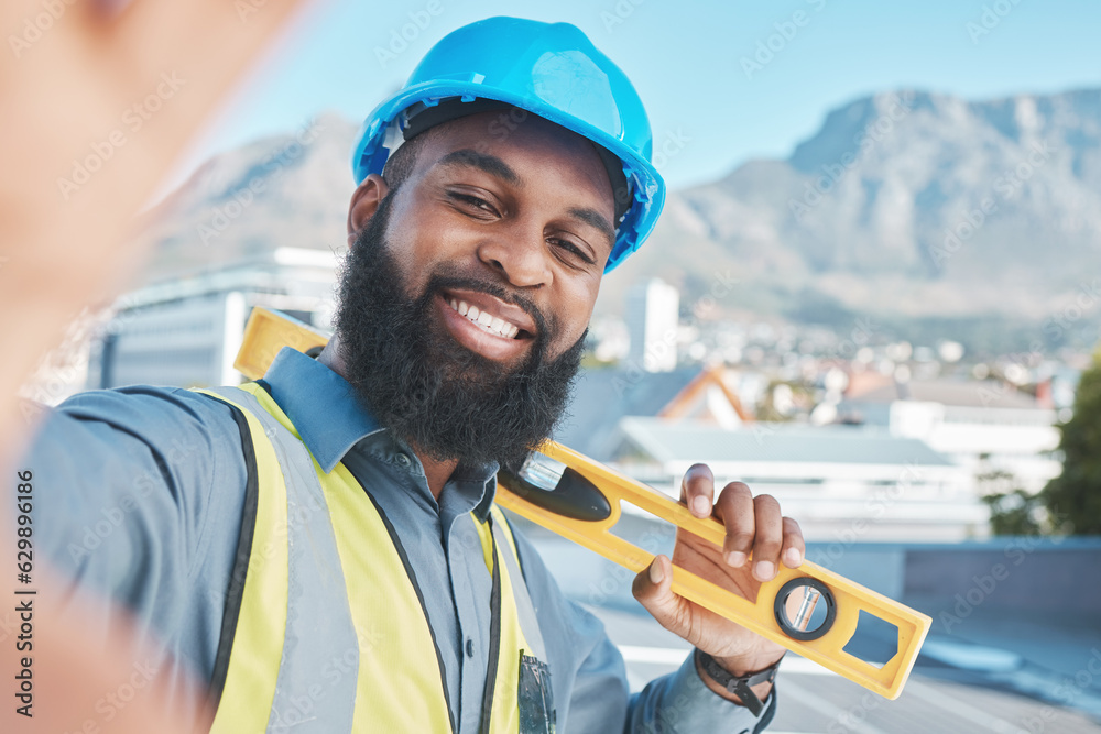 Naklejka premium Construction, worker and selfie portrait of man in city for building project, labor and civil engineering. Face of happy african architect, photograph and ruler for property development in Cape Town