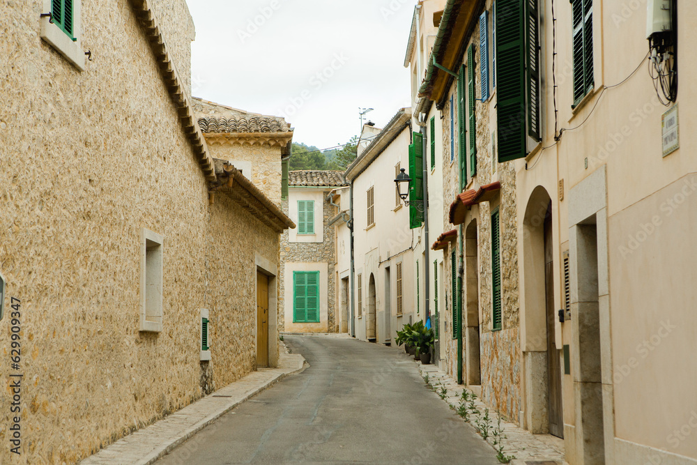 View of a medieval street of the picturesque Spanish-style village Mancor de la Vall in Majorca or Mallorca island, Spain.