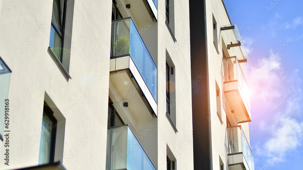Obraz premium Modern apartment building in sunny day. Exterior, residential house facade.