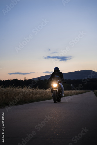 Riding a Yamaha motorcycle at sunset