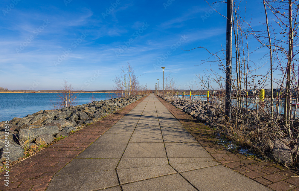 Zweckau, Germany - 9. February 2023: Impressions from Zwenkauer harbor in winter. The former lignite or coal mining area near Leipzig is now a lake landscape, the Neuseenland. Former lignite mining