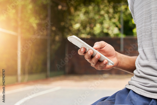 Smartphone in hand, person outdoor and typing, social media scroll and communication with mobile app. Using phone while at sports playground, texting and online chat with contact and technology