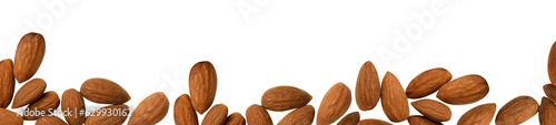 Many almond nuts border isolated on transparent background. Png randomly scattered dry kernels. Top view. Long horizontal banner layout. Food element for vegetable oil packaging. Raw natural snack
