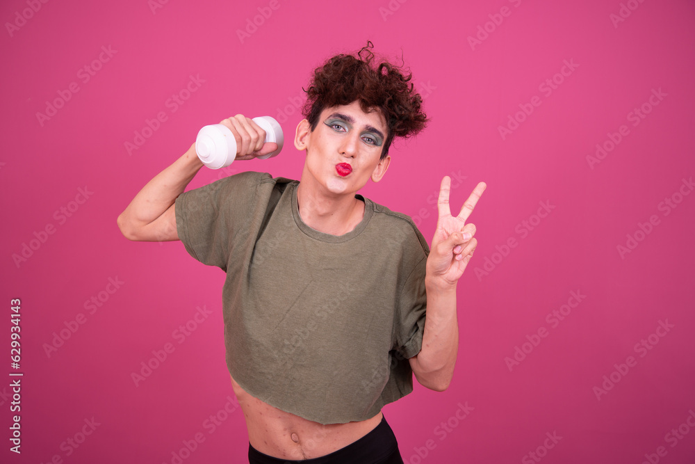 lgbt culture. Funny Drag Queen is engaged in fitness. Pink background. lgbt culture. Funny Drag Queen is engaged in fitness. Pink background.
