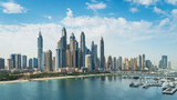 The Palm Jumeirah archipelago opens the view on the coast of the mainland with sand beaches and skyline of Dubai Media City and Dubai Marina with skyscrapers, Dubai, UAE
