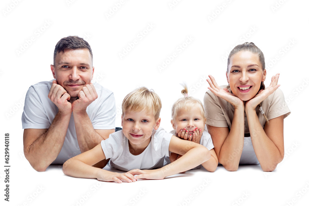 Smiling family with two small children lie on the floor isolated on white. Mom, dad and little son and daughter. Love and tenderness. Smiling family with two small children lie on the floor isolated on white. Mom, dad and little son and daughter. Love and tenderness.
