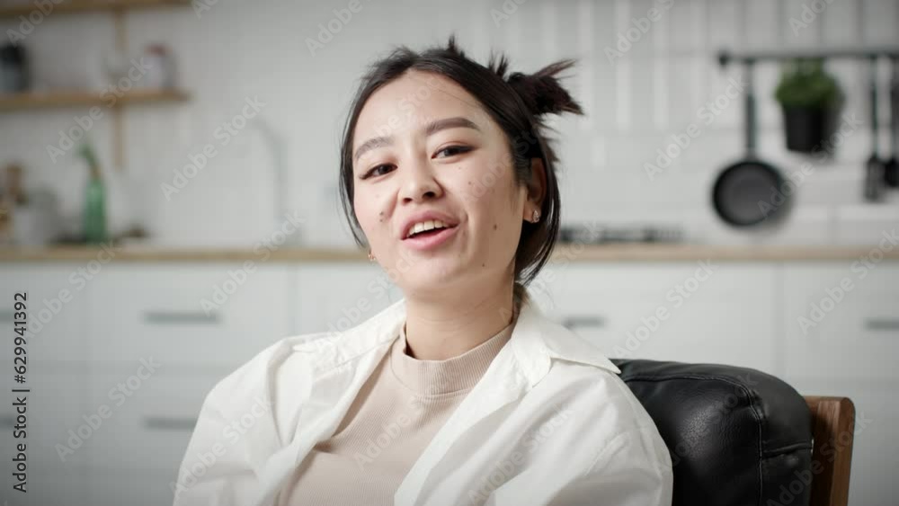 Asian 30s Woman Speaking Looking at Camera. Smiling female talking at camera. Asian 30s Woman Speaking Looking at Camera. Smiling female talking at camera.