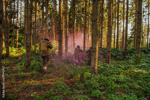 Photography A group of modern warfare soldiers is fighting a war in dangerous remote forest areas