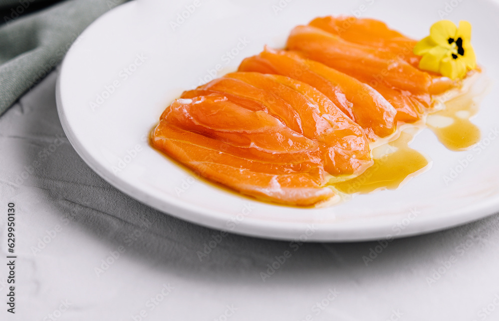 Chopped fresh salmon fillet on white plate Chopped fresh salmon fillet on white plate