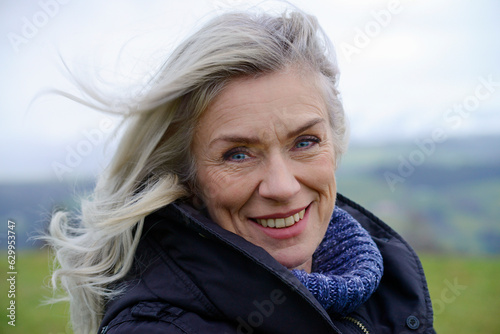 Germany, Sonthofen, Portrait of smiling woman outdoors photo