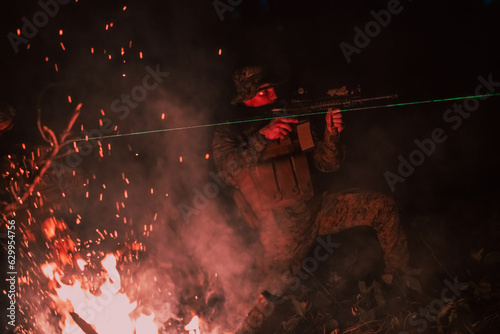 Soldiers squad in action on night mission using laser sight beam lights military team concept