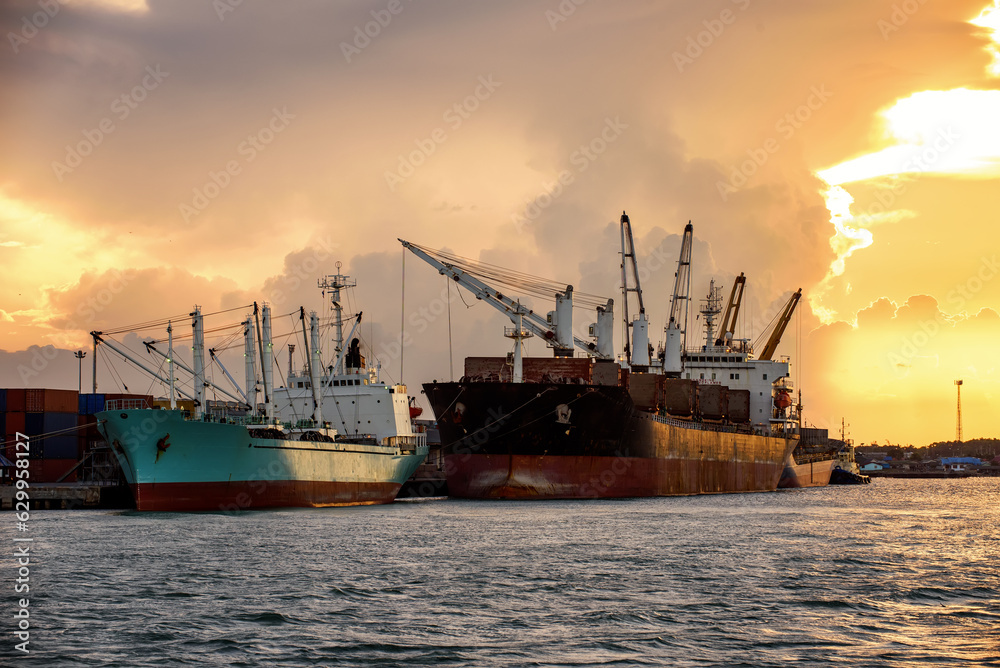 Cargo ship loading containers at sunshine