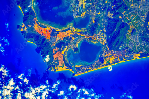 Fototapeta Naklejka Na Ścianę i Meble -  Gangmen Harbor and The fish farms of Hainan Island in Southern China.
Digital enhancement of an image furnished by NASA