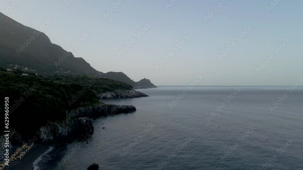 Aerial view of the long coastline with inlets facing the Mediterranean Sea at sunset, Maratea, Potenza, Italy. Aerial view of the long coastline with inlets facing the Mediterranean Sea at sunset, Maratea, Potenza, Italy.
