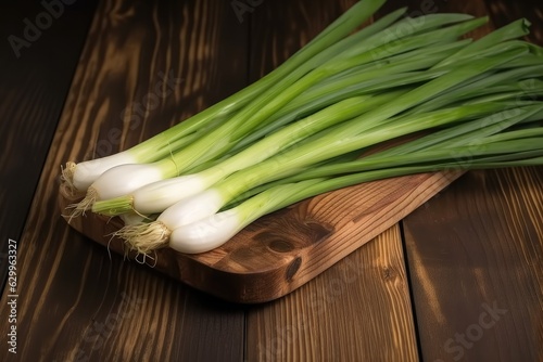 Fresh green onions on wooden background, Eco vegetables, Fresh vegetable concept.