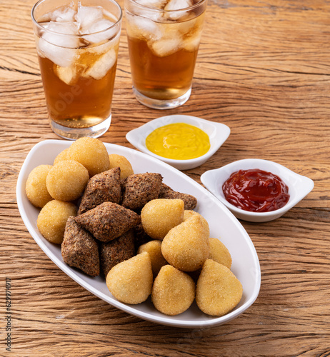 Coxinha, kibbeh and cheese balls, typical brazilian snacks