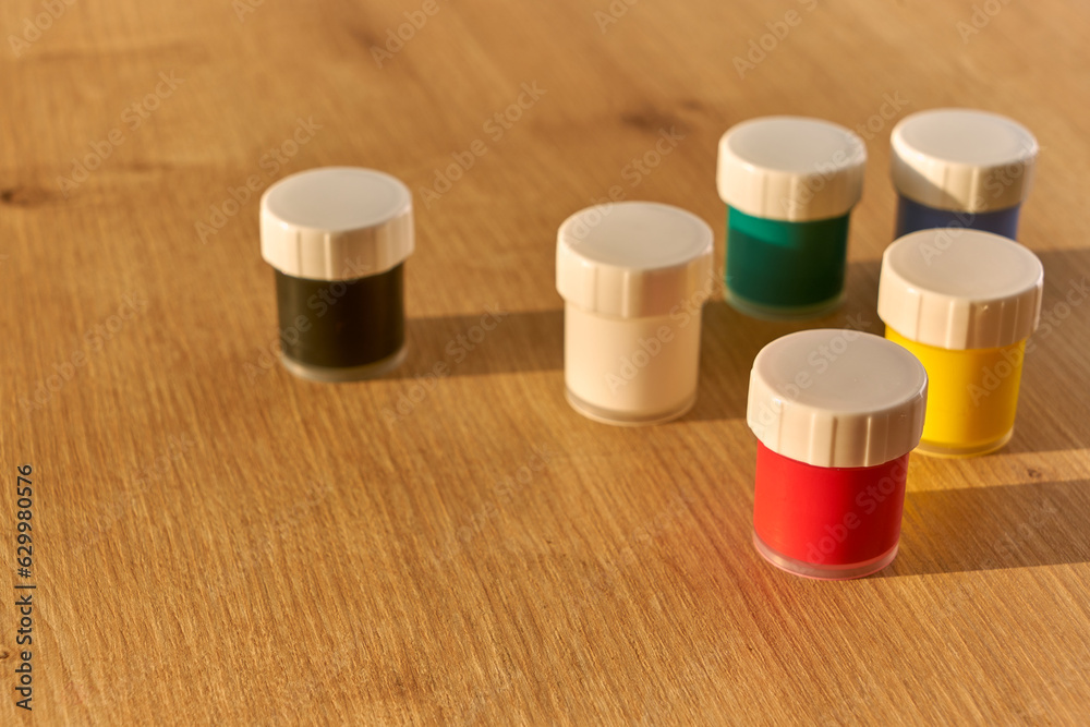 Red, blue, yellow, black, white ,green colored gouache paint ans. Jars of gouache. Paint. Gouache. Jar. Dye. Acrylic. Red, blue, yellow, black, white ,green colored gouache paint ans. Jars of gouache. Paint. Gouache. Jar. Dye. Acrylic.