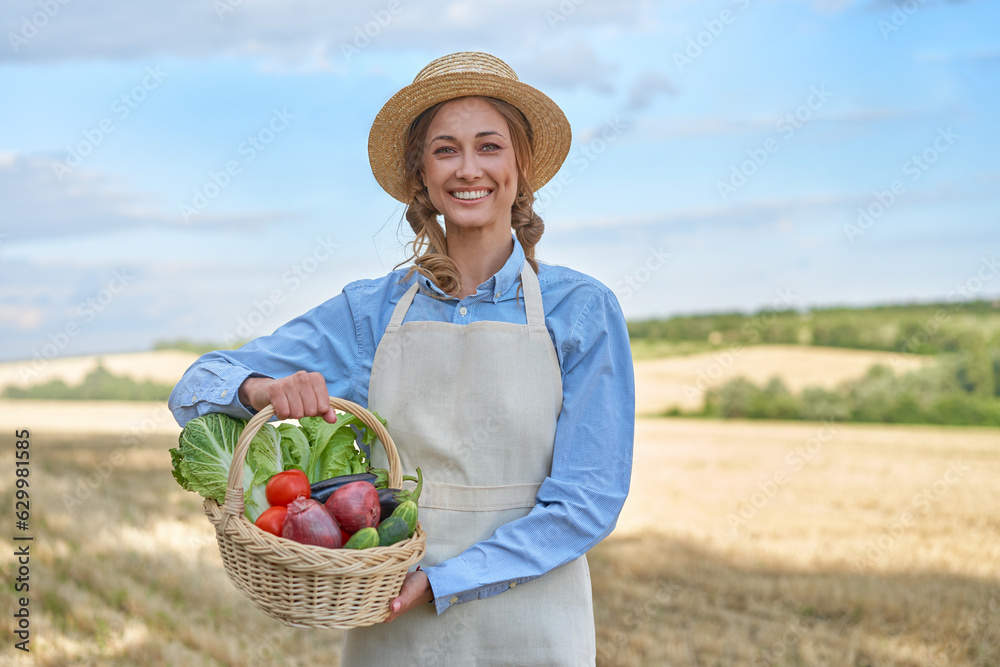 Woman farmer straw hat apron standing farmland smiling Female agronomist specialist farming agribusiness Happy positive caucasian worker agricultural field