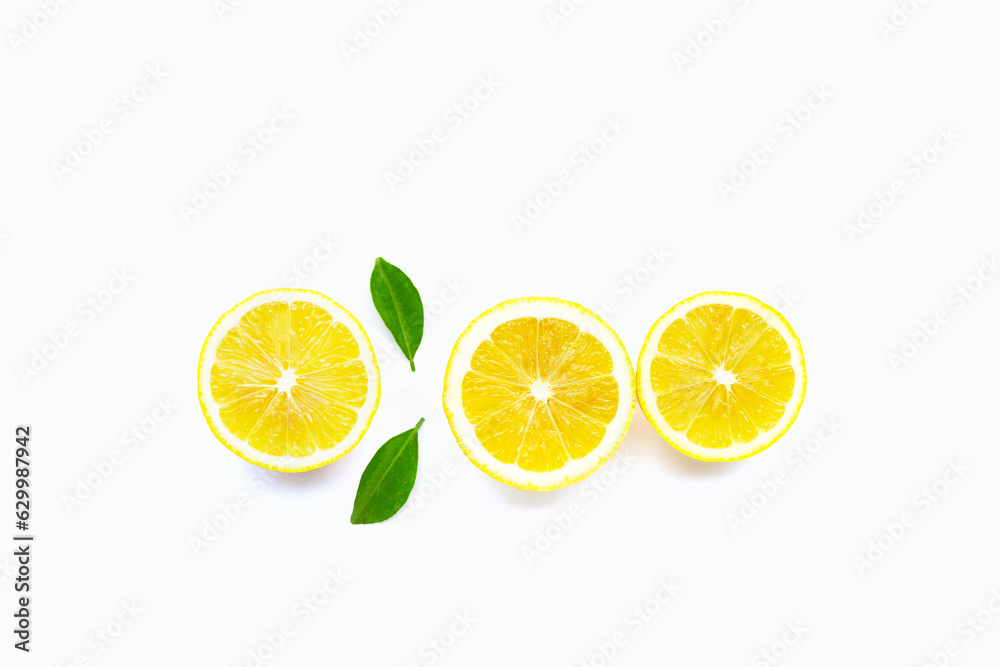Fresh lemon with green leaves on white. Copy space for text or product Fresh lemon with green leaves on white. Copy space for text or product