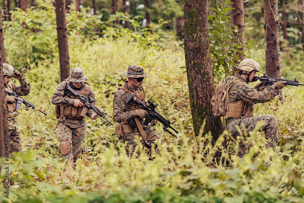 A group of modern warfare soldiers is fighting a war in dangerous remote forest areas. A group of soldiers is fighting on the enemy line with modern weapons. The concept of warfare and military A group of modern warfare soldiers is fighting a war in dangerous remote forest areas. A group of soldiers is fighting on the enemy line with modern weapons. The concept of warfare and military