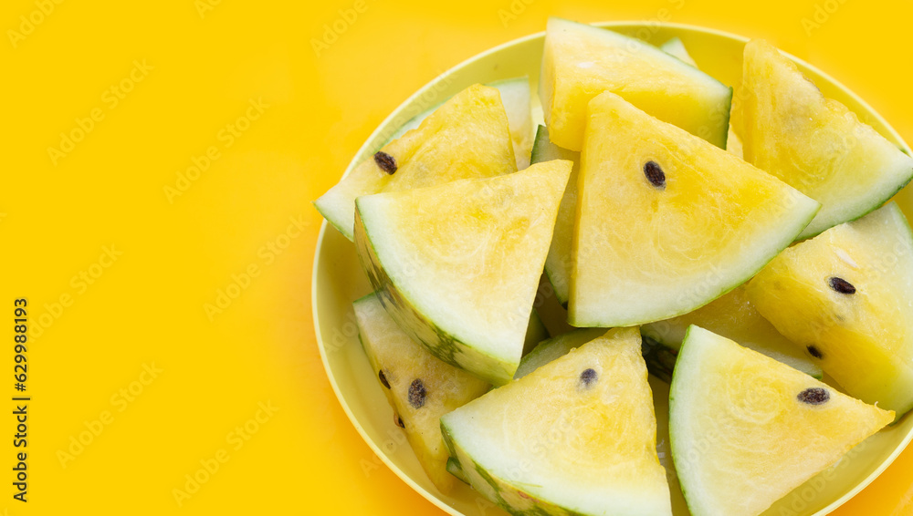 Yellow watermelon slices on yellow background. Yellow watermelon slices on yellow background.